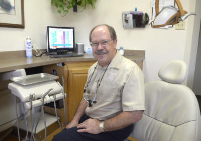 "For the single guy on the corner it's going to be very difficult to compete any more," dentist Robert Gherardi, says.  (Dean Hanson/Albuquerque Journal)